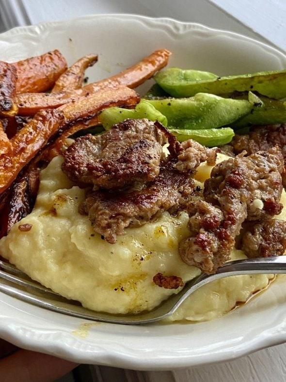 mashed potato bowl with sausage and veggies.