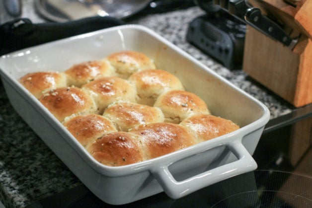 garlic rolls in a white dish.