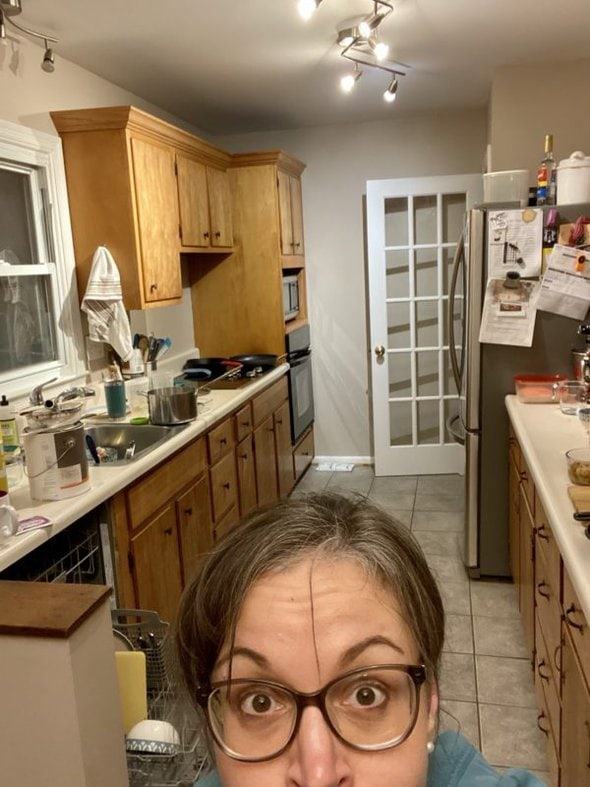 Kristen in her messy kitchen.